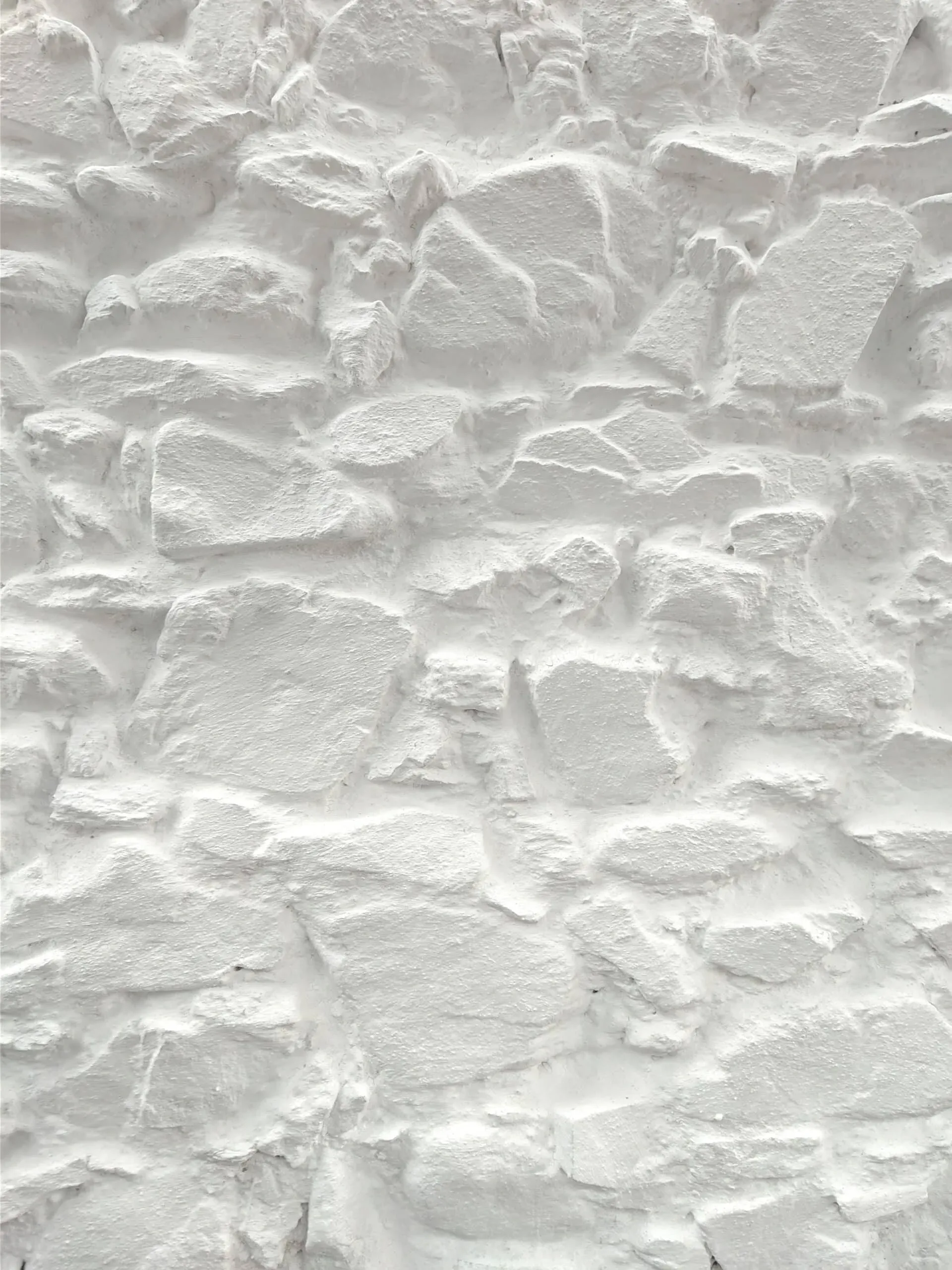 Textura vibrante de mampostería encalada, unión de piedra y cal en la arquitectura vernácula