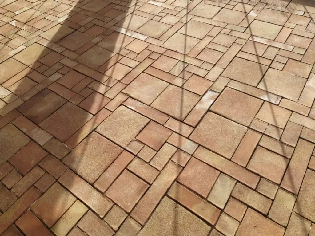Detail of clay floor with herringbone pattern, showing natural tonal variation
